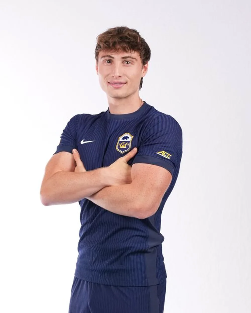 Kai Oppenheim in the Cal kit, arms folded